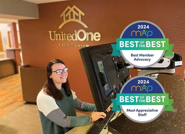 UnitedOne employee typing at a desk